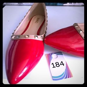 Red and tan studded flats